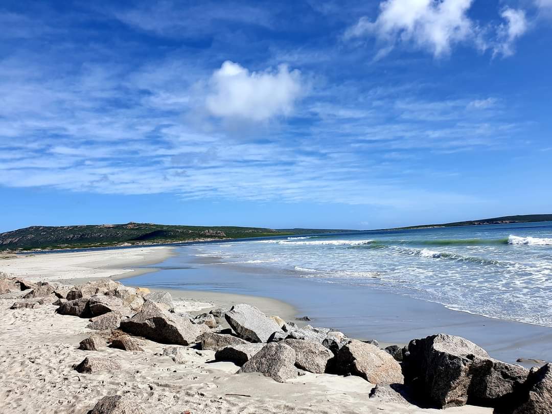 Open beach, blue sky and clear coastal water near Langebaan