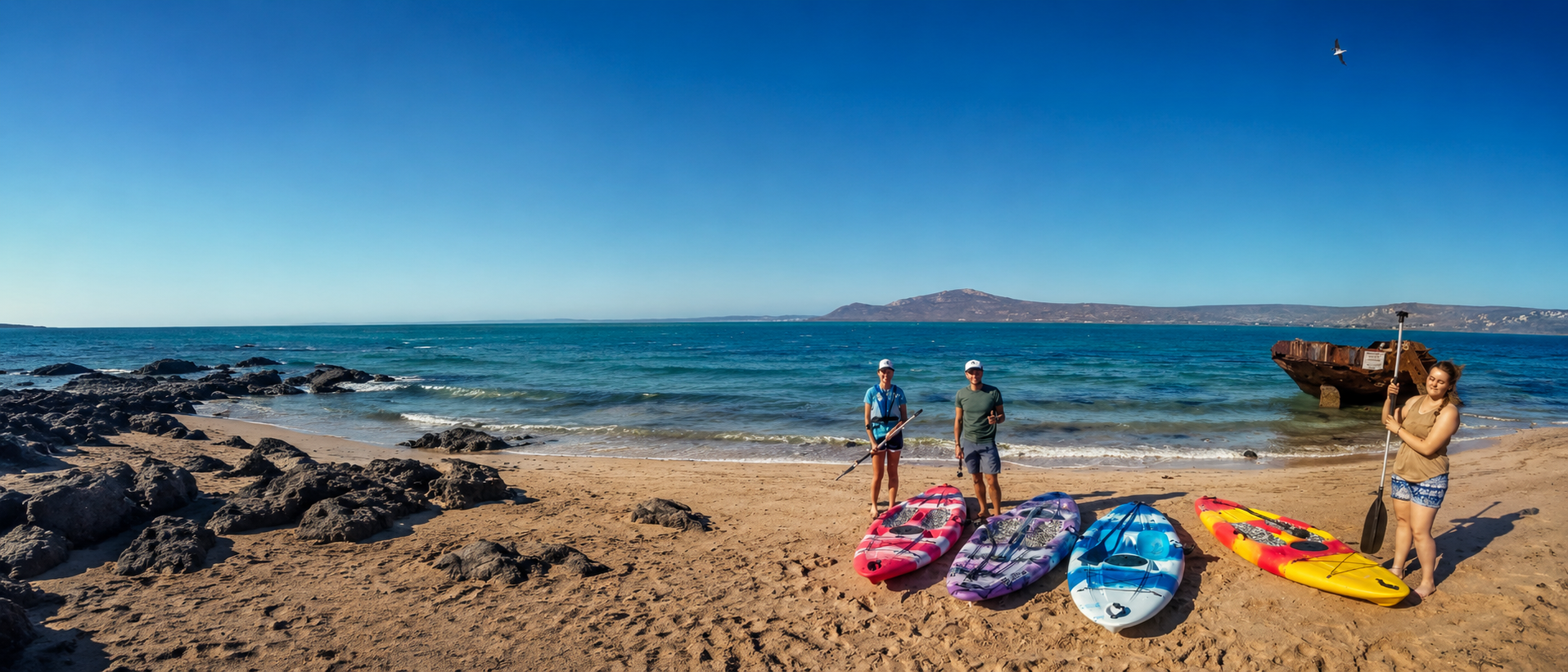 C-Kite paddle boards and people ready for activities on the Langebaan shoreline